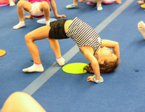 a girl doing a back bend