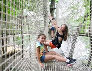 Two girls playing in nets