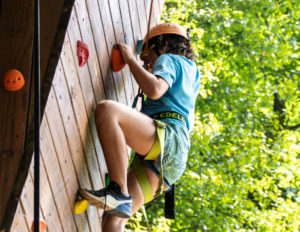 a child on a climbing wall