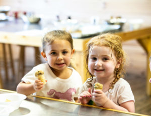two girls eating ice cream from cones