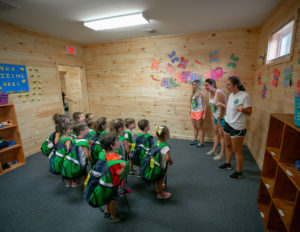 counselors speaking to a group of campers